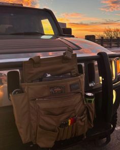 the back end of a pickup truck with an assortment of items in it