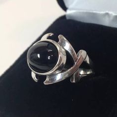 Gorgeous Black Onyx & Sterling Silver Split Shank Ring This piece features a comfortable split shank, with a bold, layered criss-cross design. * Cabochon Cut Genuine Black Onyx Oval measures 14mm x 10mm * Comfort Fit Band * Solid Sterling Silver * Size 7 (size 8 also available, please allow 3-5 days handling time for this size) Hallmarked & Gift Ready! Matching Cuff Bracelet Available here- https://www.etsy.com/listing/291464103/genuine-black-onyx-sterling-silver-ring?ref=shop_home_listi Black Metal Punk Rings, Black Punk Metal Rings, Punk Style Black Metal Rings, Adjustable Black Punk Style Rings, Punk Style Adjustable Black Ring, Black Sterling Silver Punk Rings, Black Gothic Round Jewelry, Gothic Black Round Jewelry, Split Shank Ring