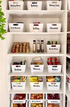 an organized pantry with white bins filled with food