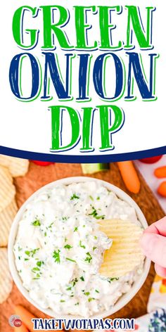 green onion dip with tortilla chips and carrots in the background text overlay reads, green onion dip