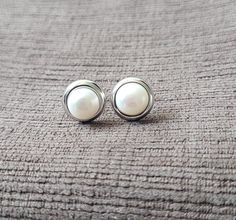 Sterling silver with rhodium, 8mm fresh water pearl stud earrings 🌟 All our Silver Jewelry are handmade or handcrafted and guaranteed 925 silver.  ⭐️Free silver polishing cloth  ⭐️ It's completely natural for sterling silver to oxidize over time when it's exposed to air. Please, keep them in airtight plastic bag and use sterling silver polishing cloth to make them shine like new again. ⭐️ Each piece is packed in its own drawstring pouch and ordered is mailed out in bubble mailers to avoid any damages that can happen during transportation. Classic Silver Pearl Earrings For Everyday, Minimalist Nickel-free Pearl Earrings For Formal Occasions, Minimalist Hypoallergenic Pearl Earrings For Formal Events, Classic Sterling Silver Pearl Earrings Gift, Silver Round Pearl Earrings As A Gift, Formal White Gold Pearl Earrings Nickel-free, Formal White Gold Pearl Earrings Nickel Free, Everyday Sterling Silver Pearl Earrings, Silver Minimalist Pearl Earrings For Gift