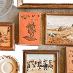 there are many framed pictures on the wall next to each other, including one with a cowboy theme