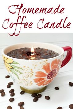 homemade coffee candle in a mug with coffee beans around it