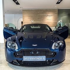 a very nice looking blue car in a showroom