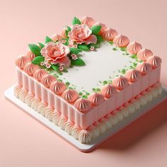 there is a cake with pink flowers on the top and green leaves on the bottom