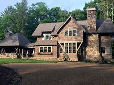 a large house in the middle of a wooded area