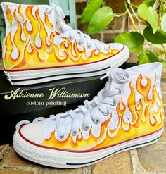 Custom painted Fiery Flames in Yellows, Oranges and Reds painted on Converse Chuck Taylor sneakers for  men or women.  This was a really fun custom design that turned out so Awesome! The yellows and oranges colors against the white background canvas shoe just pops! I can paint flames on any color converse shoe though, so send me a message should you want something a bit different. I have them listed for both low and hi tops in black, gray or white.  This listing is for the sizes listed ONLY. I have a listing for Child sizes here: https://www.etsy.com/listing/476197396/kids-converse-custom-converse There is a price difference.  I have the sizes listed in Men's/Women's scale. This listing is for adult size only.  I would love to paint some really Awesome Shoes just for you or yours! Send me Shoe Painting Ideas Converse, Paint Flames, Painted Flames, Flame Shoes, Black Converse High Tops, Fire Shoes, Color Converse, Chuck Taylor Shoes, Converse Custom