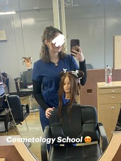 a woman is getting her hair cut by a mannequin