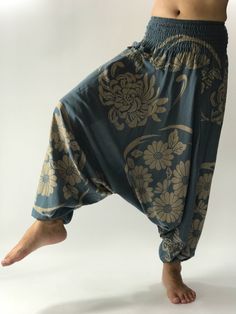 "These super soft rayon baggy unisex harem pants have the \"flow\", perfect of yoga or just a cool strolling. Comfort and character are what these pants are all about. They have the traditional sarong look & feel but a lot more practical when it comes to activity like yoga. As a bonus, they are convertible! Just pull them up and you get yourself a cute jumpsuit in a flash. Together with elastic cuff legs, you can wear them short or long. The pants have smock waist (wide bang elastic) with no Hippie Style Harem Pants For Loungewear, Bohemian Relaxed Fit Harem Pants For Yoga, Blue Harem Yoga Pants, Comfortable Baggy Harem Pants For Yoga, Bohemian Harem Yoga Pants With Relaxed Fit, Yoga Harem Pants With Elastic Waistband, Bohemian Relaxed Fit Harem Yoga Pants, Traditional Relaxed Fit Harem Pants For Yoga, Traditional Harem Pants For Yoga