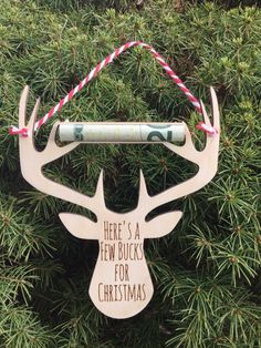 there's a new bucks for christmas ornament hanging on a tree branch