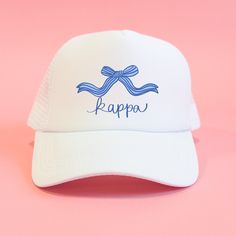 a white cap with the word kappo on it and a blue bow at the front