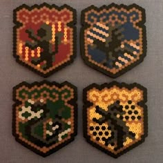 four pieces of beaded art depicting the emblems for harry potter's hogwarts