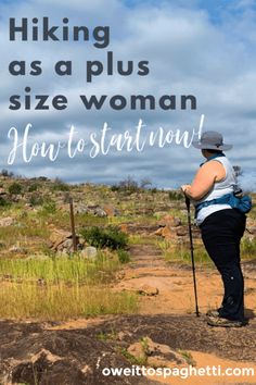 a woman standing on top of a dirt field holding a walking stick with the words hiking as a plus size woman how to start now