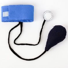 a piece of cloth with a clock on it and a cord attached to the end