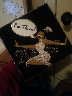 a decorated graduation cap that says i'm there with a woman dancing on it