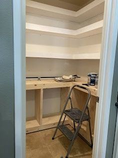 a ladder is sitting in the middle of a room that has been built into it