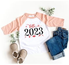 "Hello 2023 Toddler Shirt, 1st New Years Onesie®, Happy New Year 2023 Kids Tee, My First New Years Kids Tee, Hello 2023 Baby Onesie® Name printed alphabet t-shirts will add beauty to you, your students,your baby, your children, your toddler, your girls, your daughter. Customized, personalized alphabet, name, letter t-shirts are waiting for you. Whether you're buying for yourself or for someone else, we're sure this t-shirt is the perfect  gift! back to school shirt,First day of school,1st day of school,kindergarten shirt,school shirt,personalized shirt,kids school shirt, Premium Quality Printed in the USA. H O W TO O R D E R T - S H I R T 1-) Please, Check and Review all Photos. 2-) Select Your T-shirt Color. 3-) Select Your T-shirt Size. 4-) Click ADD TO CART and You can go back to add mo New Years Onesie, New Years Kids, Hello 2023, Happy New Year 2023, School Kindergarten, Kindergarten Shirts, New Year 2023, 1st Day Of School, Letter T