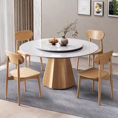 a white table with four chairs around it