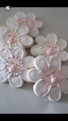 some white and pink flowers on a table