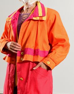 "J Gallery/ 80's Anorak Jacket/ 80's Rave/ Hot Pink Anorak/ Spring Skiing Anorak/ Orange Anorak/ 80's Windbreaker/ Size M J Gallery coats never disappoint! This 80's anorak is so festive! Superb take on 80's color blocking! Not really suite for downhill, but perfect for apres ski! In excellent condition. Bright yellow buttons down the front! Front pockets. Tie string bottom hem. Built in shoulder pads. Model is 5'4\" and a size 4 for scale. Please see exact measurements below. Item measured whil Orange Sporty Windbreaker, Retro Pink Long Sleeve Windbreaker, 80s Windbreaker, Orange Hooded Nylon Outerwear, Orange Nylon Long Sleeve Windbreaker, Vintage Multicolor Windbreaker With Pockets, 70s Denim, Spring Skiing, Dog Fleece