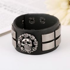 Do you love the gothic outfit? you should read our blog on the topic. this gothic leather skull is designed for dark outfits and dark minds! get yours without waiting! Greetings ladies and gentlemen, are you looking for a simple, sober, stealthy new bracelet to add to your collection, if so then this gothic skull bracelet will be ideal for you, with its great design and simplicity it will go very well with most of your outfits especially since it is colored in black and silver and we know that b Halloween Punk Skull Bracelets, Adjustable Black Leather Bracelet For Halloween, Punk Black Skull Bracelets, Black Skull Punk Bracelets, Edgy Black Bracelet For Halloween, Edgy Black Halloween Bracelet, Silver Skull Leather Bracelet In Punk Style, Punk Silver Leather Skull Bracelet, Black Gothic Leather Bracelet With Skull Shape