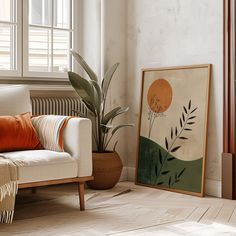 a living room with a couch, plant and window