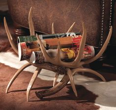 the antler is holding magazines on it's legs