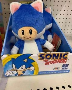 sonic the hedgehog plush toy sitting in a box on display at toys r us