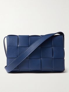 Bottega Veneta's messenger bag has been crafted in Italy using the brand's signature intrecciato weave. It's made from 'Cruise' blue leather and features a silver-tone arrow buckle along the shoulder strap. Store your phone and AirPods in the fully integrated shell pouch inside. Blue Rectangular Bag With Intrecciato Weave, Designer Rectangular Shoulder Bag With Intrecciato Weave, Blue Shoulder Bag With Intrecciato Weave, Designer Blue Shoulder Bag With Woven Leather, Designer Blue Woven Leather Shoulder Bag, Blue Leather Shoulder Bag With Woven Detail, Luxury Intrecciato Rectangular Shoulder Bag, Modern Rectangular Shoulder Bag With Intrecciato Weave, Designer Square Bag With Woven Leather