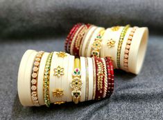 Heavy rajputi chura. Dhal Uttar chura. Indian wedding bridal rajputi chura in ivory colour with beautiful kundan work. Royal rajputi look. This is a beautiful handmade bangle set with Rajputi, Marwari and Rajasthani cultural look made in pure boor material and other material bangles also included. We are based in Jodhpur Rajasthan which is a city of rich heritage culture and the same touch we provide in our designs. we provide premium quality handmade designer bangles with rich stone and kundan work perfect for all traditional outfits and also for gifting purpose. This is a royal bridal chura with rich kundan work on boor base. A premium product. Traditional White Bangle For Puja, White Tilla Bangle For Diwali, White Kundan Jewelry For Wedding And Festivals, White Bangle With Stone Work For Diwali, Traditional White Bangle With Cutdana, Traditional White Bangle For Festive Occasions, Bollywood White Bangle For Diwali, Bollywood Style White Bangle For Diwali, Traditional White Bangle For Wedding