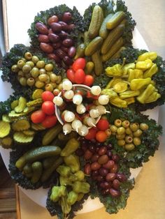 a white plate topped with lots of different types of veggies next to each other