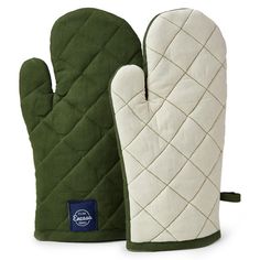 the oven mitt is green and white with a blue logo on it, next to an oven mitt