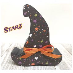 a paper wizard hat with stars on it