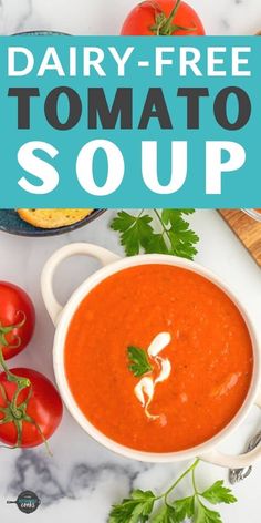 dairy - free tomato soup in a bowl with tomatoes and parsley on the side