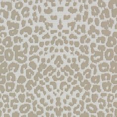 a beige and white animal print wallpaper with lots of small spots on it's surface