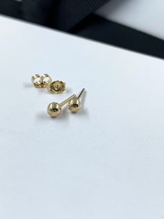 Dainty Ball Stud Earrings - Solid 14K Gold Tiny 3mm Round Earrings, Stacking Gold Earrings For Everyday, Stacking Earrings, Mother's Day Gifts. Simple, perfect everyday 14K gold tiny stud earrings that are the perfect gift. Tiny gold balls measure 3mm with your choice of backs. This listing is for one pair (2 pieces). Your choice of 14K gold clutch backs, 14K encased silicone backs or plain rubber backs. PLEASE convo me for custom orders. :) **PLEASE NOTE: THIS LISTING IS ONLY FOR ONE SET OF EAR Hypoallergenic Yellow Gold Round Bead Earrings, Gold Clutch, Stacked Earrings, Tiny Studs, Tiny Earrings, Tiny Stud Earrings, Heart Studs, Heart Earrings Studs, Earrings Photo