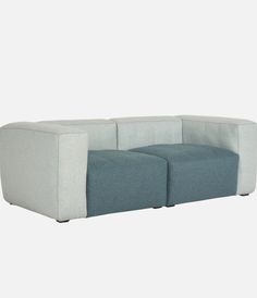 a white and blue couch sitting next to each other