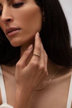 The Twisted Rope Ring is a sophisticated combination of vintage and modern woven together, creating an on-trend yet timeless look. 14k yellow gold Approx. 4mm tapered to 1.5mm Available sizes: 4, 4.5, 5, 5.5, 6, 6.5, 7, 7.5, 8, 8.5, 9 All fine jewelry orders will receive a keepsake box—perfect for storing all of your timeless pieces. All custom pieces will be final sale and shipped within 4-6 weeks via FedEx 2-day with adult signature required. All in stock items will be processed within 1-2 bus Timeless 14k Gold Rings With Decorative Band, Elegant Formal Diamond Ring Tarnish Resistant, Elegant Adjustable Rings With Diamond Cut, Elegant 14k Gold Tarnish Resistant Diamond Ring, Elegant Adjustable Diamond Cut Rings, Timeless Yellow Gold Jewelry With Decorative Band, Elegant Decorative Band Promise Ring, Fine Jewelry 14k Gold Diamond Ring With Decorative Band, Timeless Stackable Rings With Decorative Band