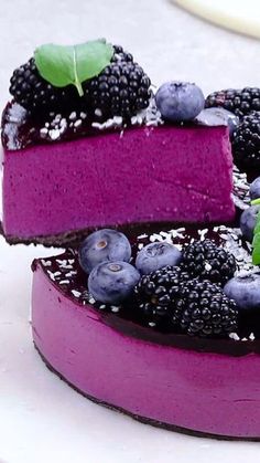 a cake with berries and blueberries on top