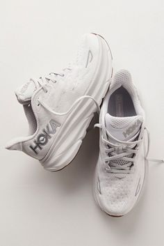 Shop our HOKA® Clifton 9 Sneakers at FreePeople.com. Boho clothing for the creative spirit- free worldwide shipping. White Tenni Shoes, Hoka Women Outfit, White Hokas Aesthetic, White Hoka Shoes, White Hoka Outfit, Hoka Outfits Women, Ankle Socks Outfit Sneakers, Cute White Tennis Shoes, Socks Outfit Sneakers