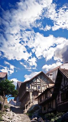 the sky is filled with white clouds above some buildings and steps that lead up to them