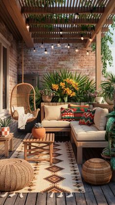 an outdoor living area with wicker furniture and potted plants