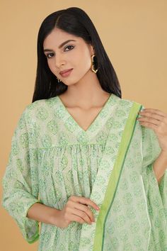 Lime green floral butti print gathered kurta with sequin work and gather detailing. Paired with a printed pant and dupatta. - Aza Fashions Green Chanderi Salwar Kameez With Printed Motifs, Green Cotton Sharara With Sheer Dupatta, Anarkali Green Sharara For Summer, Green Anarkali Sharara For Summer, Green Anarkali Salwar Kameez With Printed Motifs, Green Chanderi Anarkali Set With Printed Motifs, Green Chikankari Embroidered Palazzo Set For Summer, Green Mulmul Anarkali Set With Straight Kurta, Summer Green Chanderi Kurta