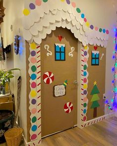 the front door to a house decorated with candy canes and christmas decorations on it