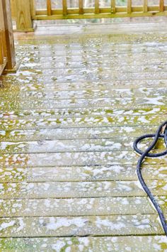 a wet floor with a hose attached to it