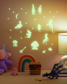 children's room with glow in the dark wall decals and toys on the table