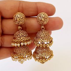 Gold plated double layered light weight Jhumka/Temple Jewelry/South Indian Traditional Jewelry/Indian/Statement earring/Indian wedding Lightweight and elegant Can be paired with any dress Closure: Pushback This is 100% Handmade jewelry. So Color, shades, texture displayed may slightly vary from the actual product due to digital image limitations. We request you to consider these minor variations. Please expect the possibility of some slight imperfections when buying hand made jewelry. If you hav Gold Cutdana Dangle Jhumkas, Indian Earrings Gold, Traditional Jewelry Indian, South Indian Earrings, Earrings Gold Pearl, Earring Indian, Gold Earrings Indian, Traditional Indian Jewellery, Temple Jewelry