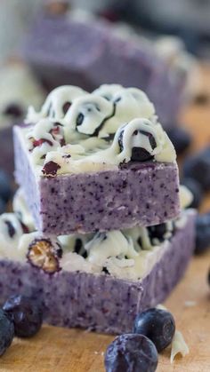 blueberry cheesecake bars stacked on top of each other