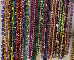 "Beads, beads, beads! Who needs Mardi Gras beads? I have all sorts of colors, shapes, and sizes in cool 90s and millennium vintage designs. Colors include purple, green, gold, black, silver, red, blue, orange, and pink. Bead shapes traditional round beads, sparkle beads, peace signs, disco balls, twists, hearts, Fleur De Lis, masks, musical instruments, footballs, and more. You can specify preferences for shapes, styles, and colors. Bead lengths vary, basically from 16\" long to 2 feet. The bead diameter sizes also vary from the standard size of 1/8 of an inch to approximately 1/2 of an inch in diameter.  You get to choose the number, style, and color of the beads you want while supplies last.  Packages are small (4 beads), medium (7 beads), and large (10 beads). Mix and match colors and d Multicolor Faceted Beads For Party, Party Beaded Necklaces With Colorful Oval Beads, Festive Multicolor Spacer Beads, Colorful Oval Beaded Necklaces For Party, Multicolor Faceted Beads For Celebration, Colorful Round Beads For Celebration, Party Beaded Necklaces With Oval Beads, Multicolor Beads For Party And Festivals, Multicolor Large Beads For Party