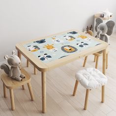 a wooden table with two chairs and an elephant on the floor in front of it